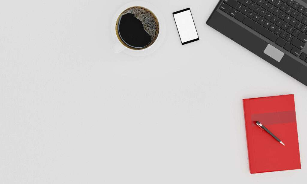 Modern Minimalist Desk Setup: Sleek Keyboard, Coffee Cup & More Wallpaper