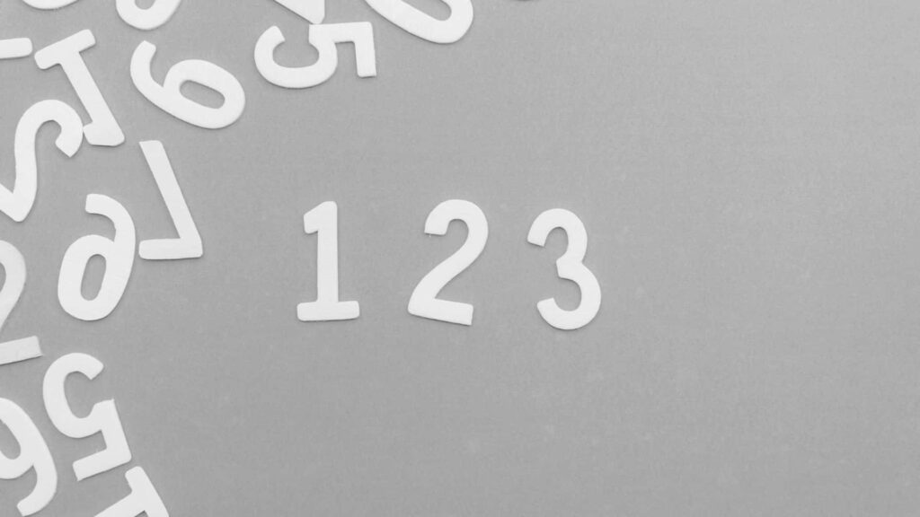 Minimalist Monochrome Wallpaper: High-Res White Numbers on Gray Background