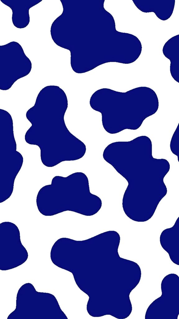 Modern cow print wallpaper with irregular navy blue patches on white for stylish decor background