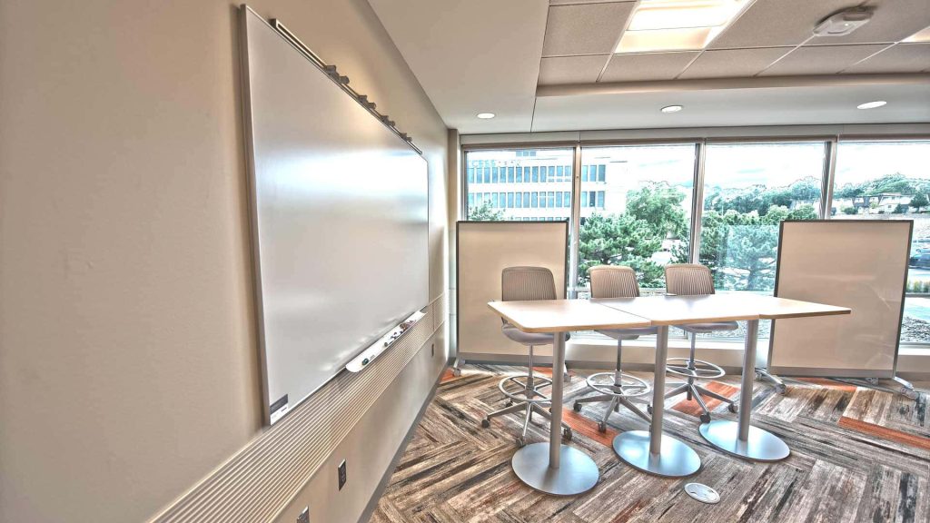 Modern conference room wallpaper with whiteboard high-top table ergonomic seating background