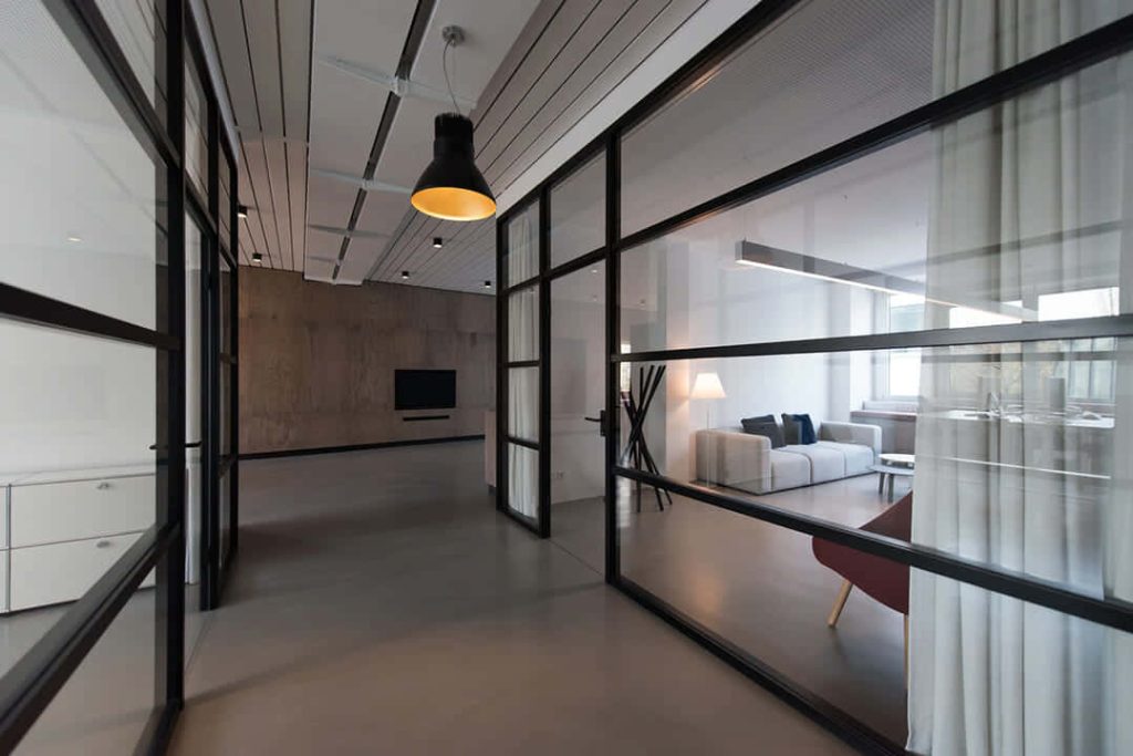 Modern professional office Zoom wallpaper with glass partitions concrete wall and lounge area