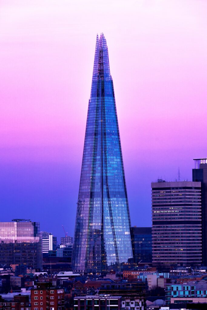 Modern Skyscraper Wallpaper: Stunning Glass Design at Sunset