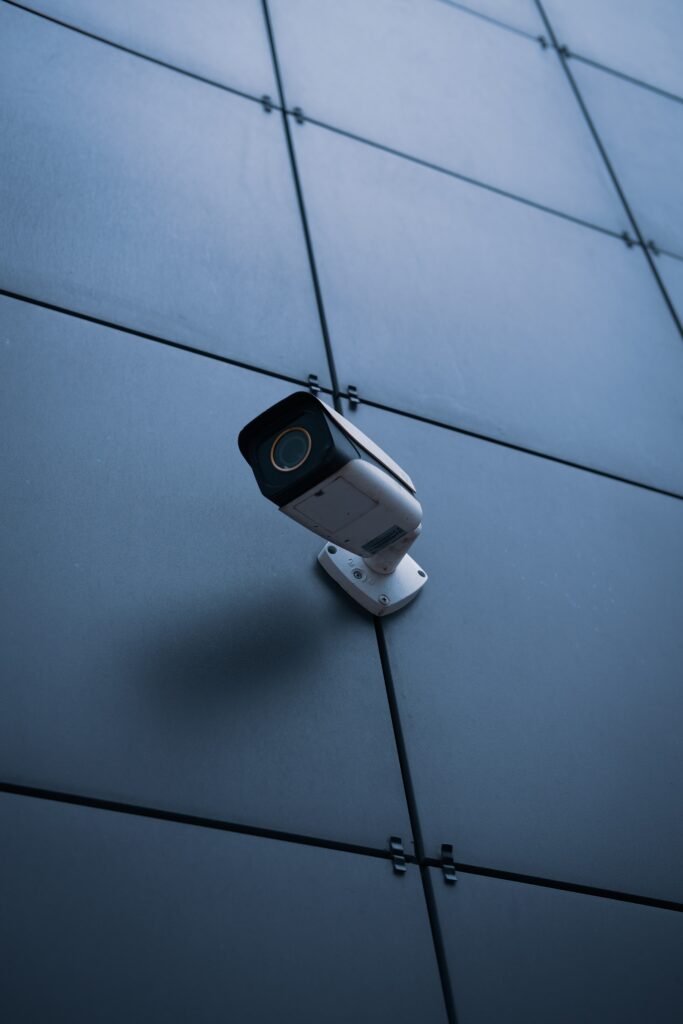 Modern Surveillance Camera on Dark Tiled Wall - Security Wallpaper