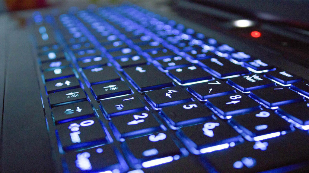 Modern Tech Wallpaper: Backlit Blue Keyboard Aesthetic Background