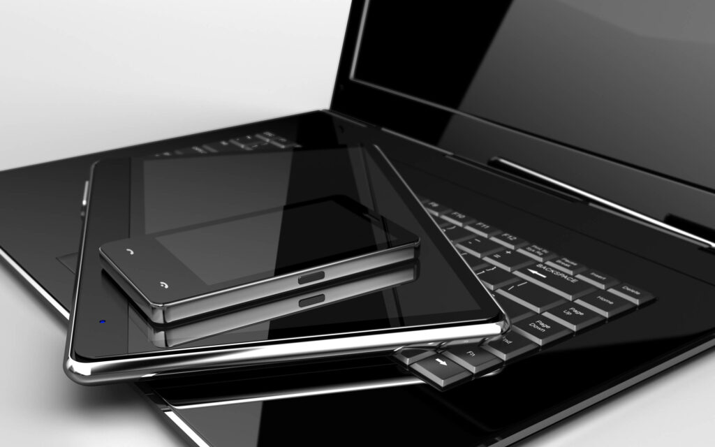 Modern Tech Wallpaper: Sleek Black & Silver Gadgets Background