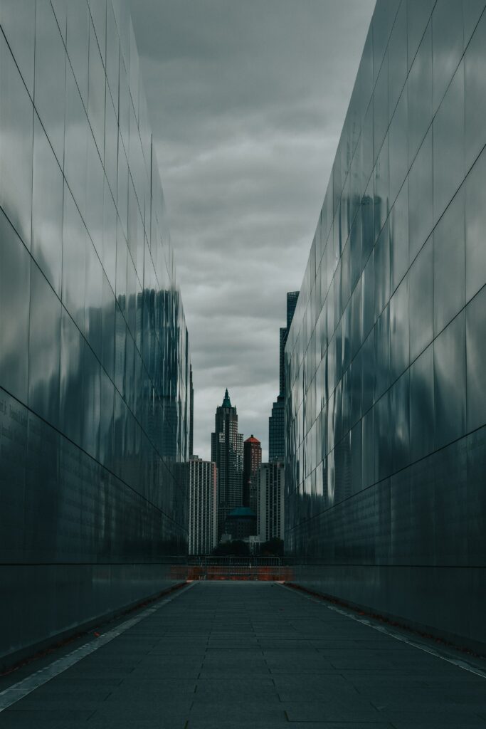 Moody Urban Wallpaper: Dramatic Symmetrical Skyscraper Reflection