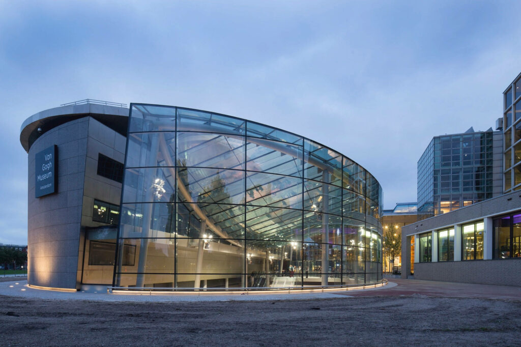 Stunning Van Gogh Museum: Modern Architecture & Illuminated Windows Wallpaper