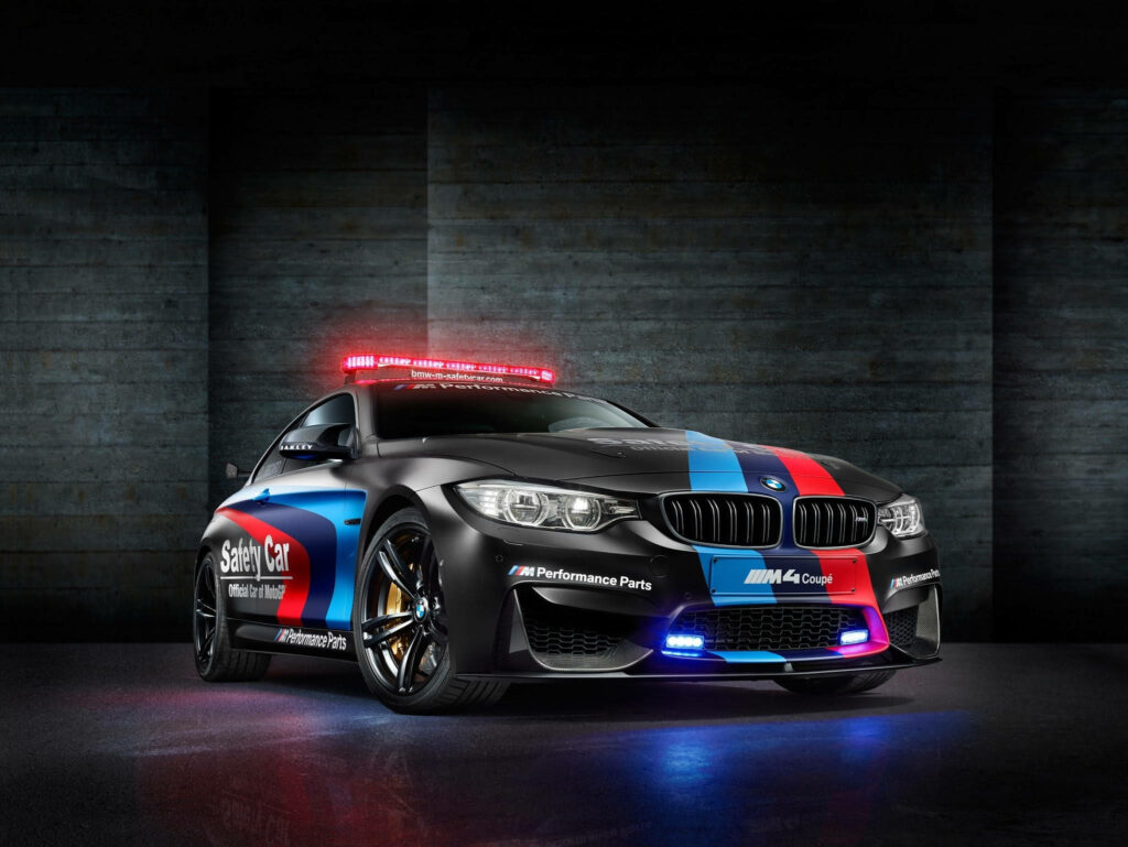 Glowing Customized Bimmer: Dynamic BMW Laptop Wallpaper Illuminating a Mysterious Space