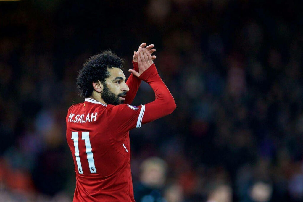 Mohamed Salah Clapping Wallpaper: Iconic Red Jersey Background