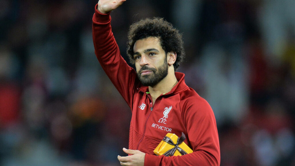 Mohamed Salah Waving in Liverpool FC Tracksuit - Wallpaper Background