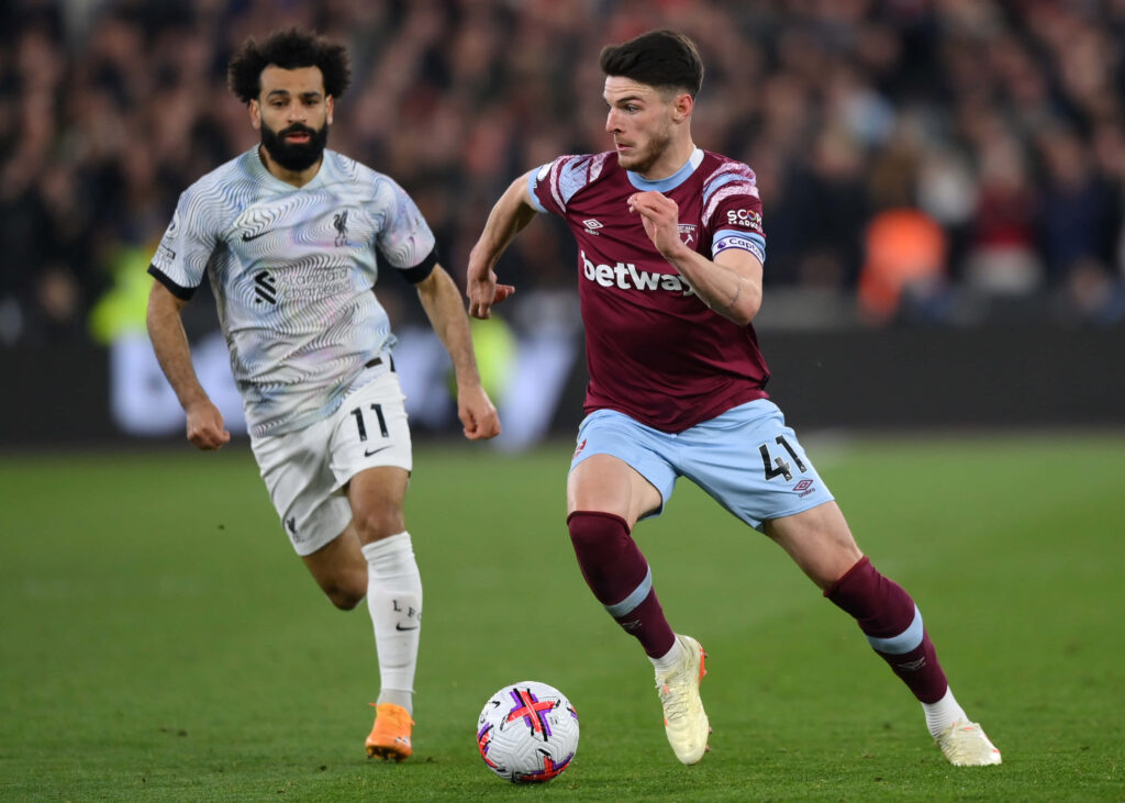 Mohamed Salah Liverpool and Declan Rice West Ham United in intense Premier League action colorful wallpaper