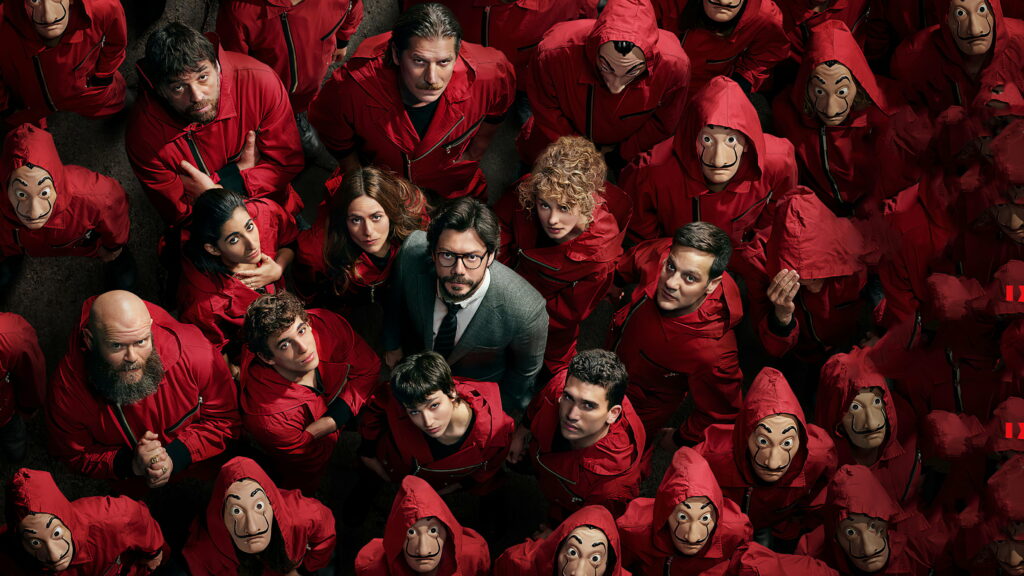 Money Heist Inspired Group in Red Jumpsuits and Dalí Masks - Mastermind at Center - Intense and Determined Gaze - Wallpaper Symbolizing Unity and Suspense