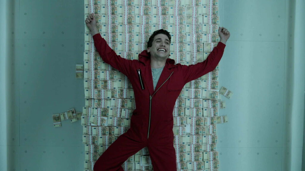 The Masterminds in Orange: Plotting the Unforgettable Heist - An Epic Scene from Netflix's Money Heist Wallpaper
