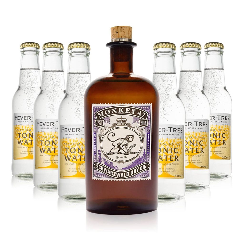 Monkey 47 Schwarzwald Dry Gin with six Fever Tree Indian Tonic Water bottles on white background Wallpaper