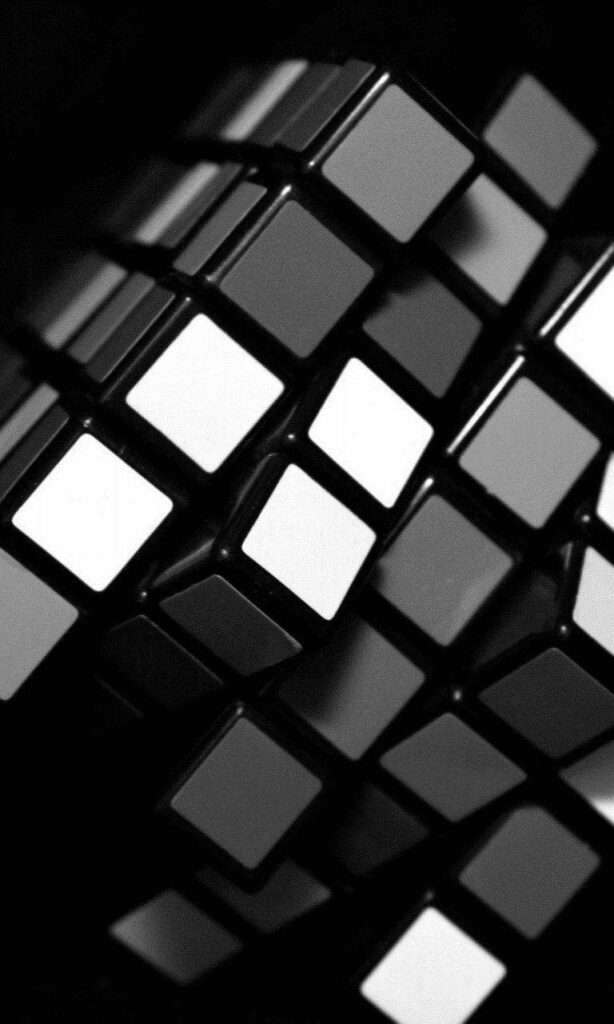 Monochromatic Puzzle: A Layered Rubik's Cube with Black and White Squares Wallpaper