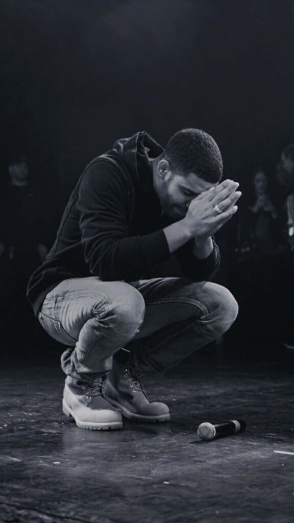 Monochrome Prayer Kneeling Man Wallpaper - Atmospheric Design