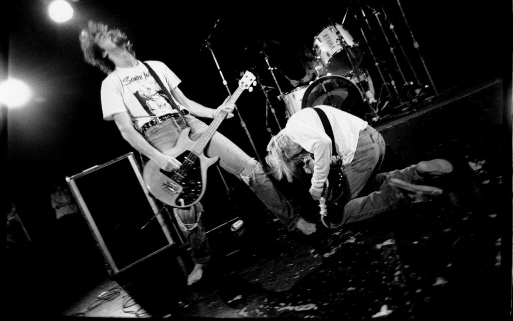 Grayscale Bliss: The Intense Harmony of Nirvana's Guitar Masters Wallpaper