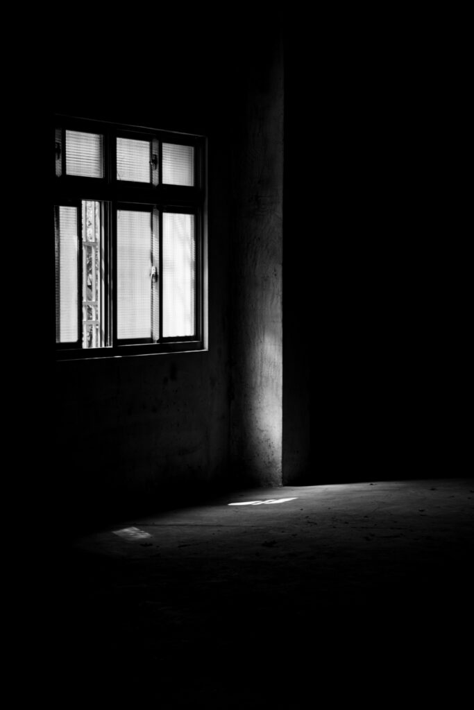 Mysterious Monochrome Wallpaper: Soft Shadows in Dim Room Background