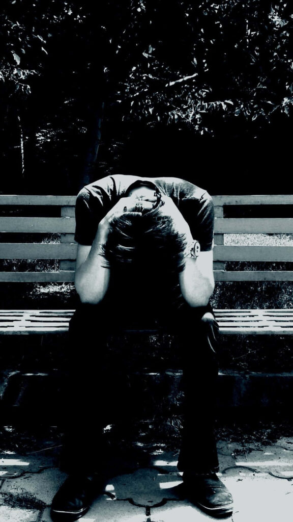Monochrome Wallpaper: Solitary Man's Sadness on a Bench
