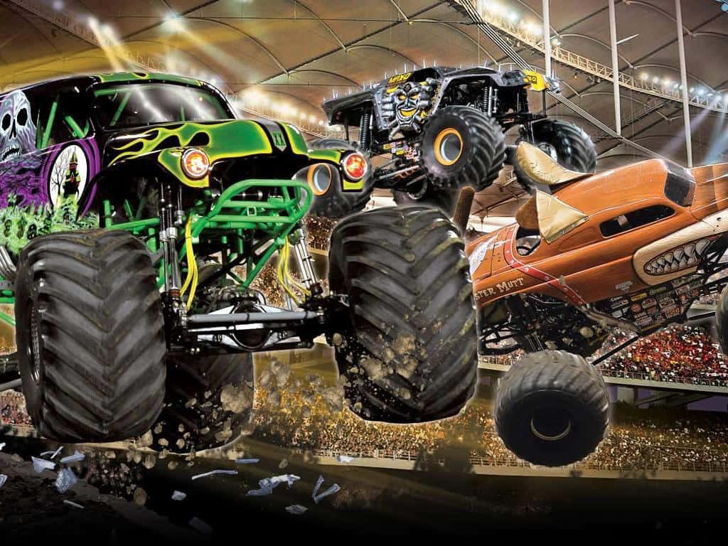 Monster Jam wallpaper with Grave Digger Maximum Destruction Monster Mutt airborne in arena