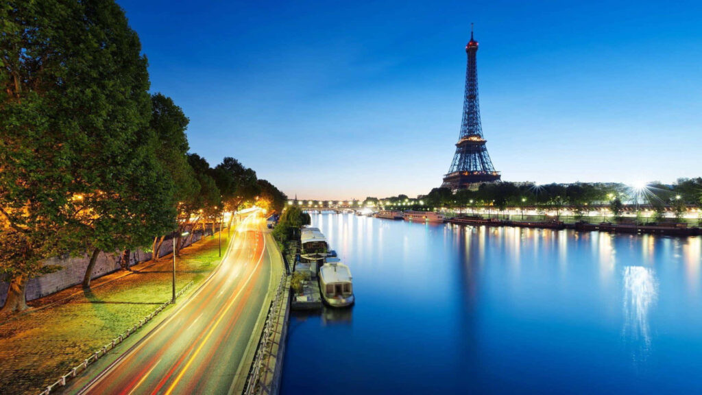 Paris Pride: The Majestic Eiffel Tower Soaring Above the City's Skyline Wallpaper