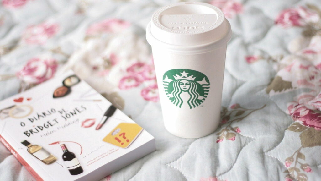 Coffee Lover's Tranquil Escape: A Cozy Retreat with a Book and Starbucks Wallpaper