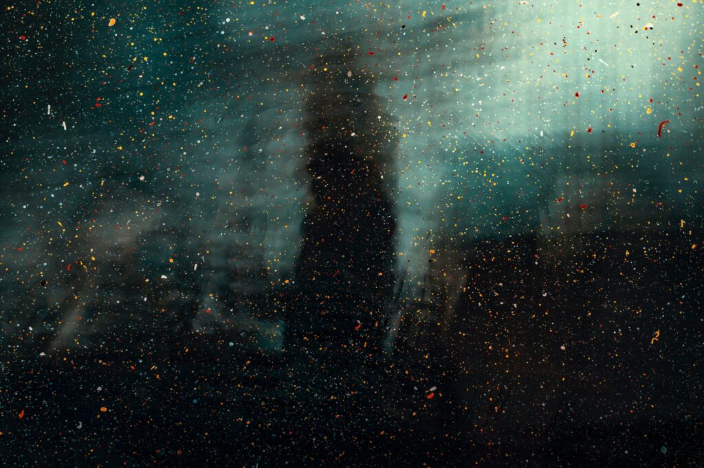 Artistic Multicolored Spray Paint Wallpaper on Reflective Glass