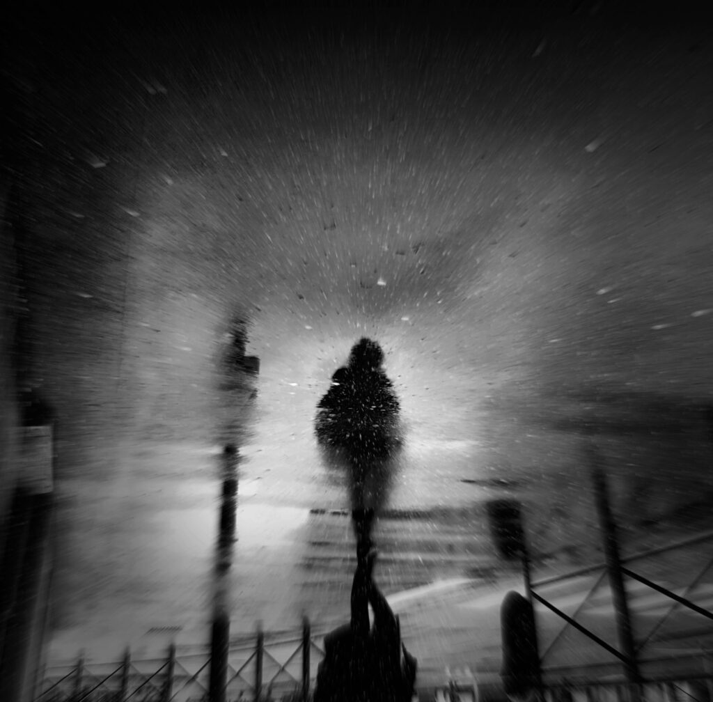 Moody Black & White Wallpaper: Silhouette Reflection in Puddle