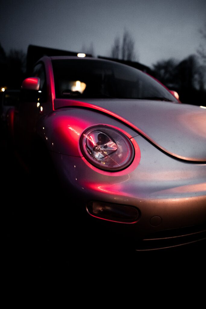 Nighttime Car Headlight Close-Up: Stylish Moody Wallpaper Background