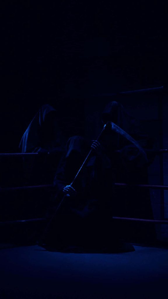 Moody cinematic wallpaper of three hooded figures in blue light with grim reaper and scythe
