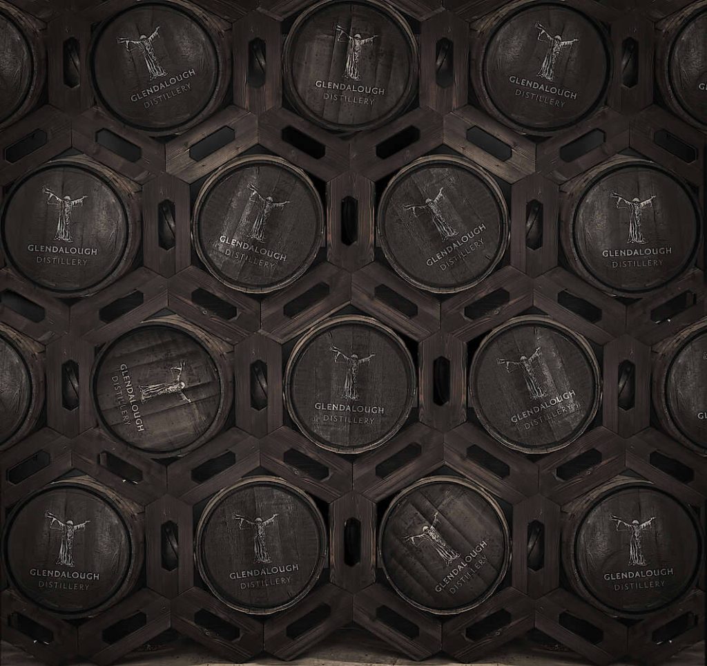 Moody wallpaper of stacked Glendalough Distillery barrels with St Kevin white logos hexagonal pattern