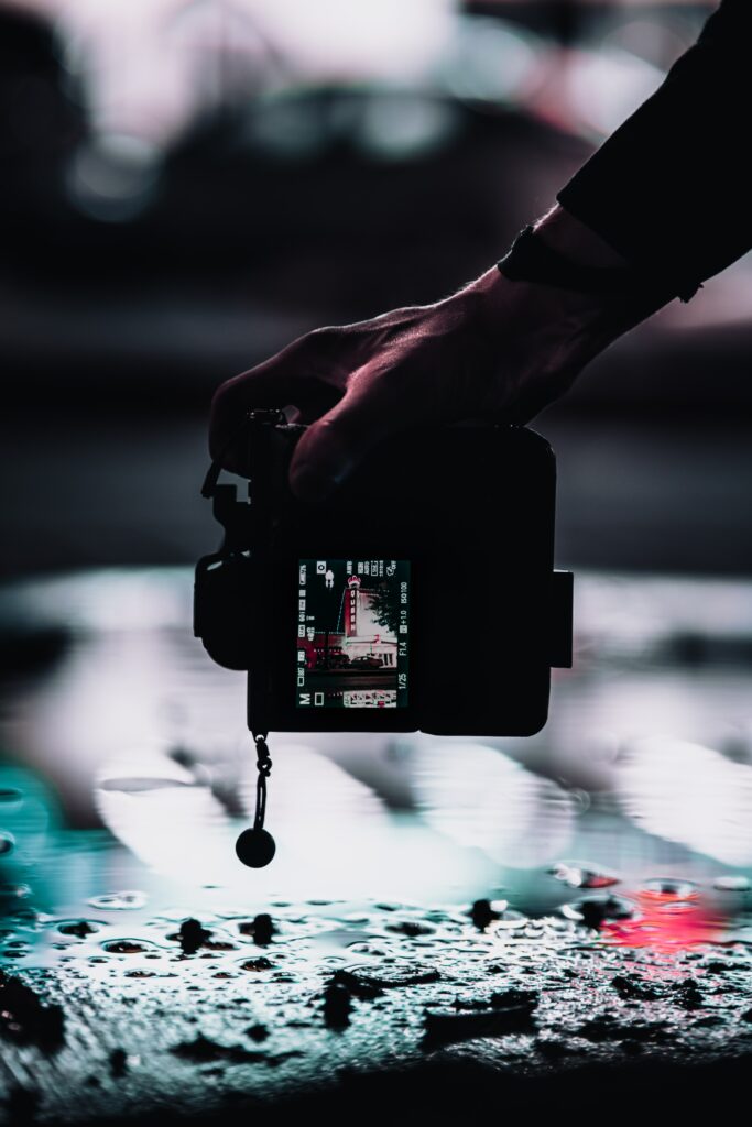Moody Nighttime Wallpaper: Camera, Urban Reflections & Vibrant Lights