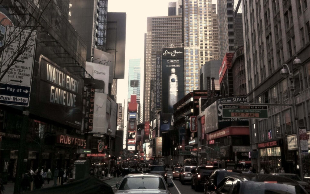 Moody Times Square Wallpaper: Bustling Traffic & Iconic Billboards