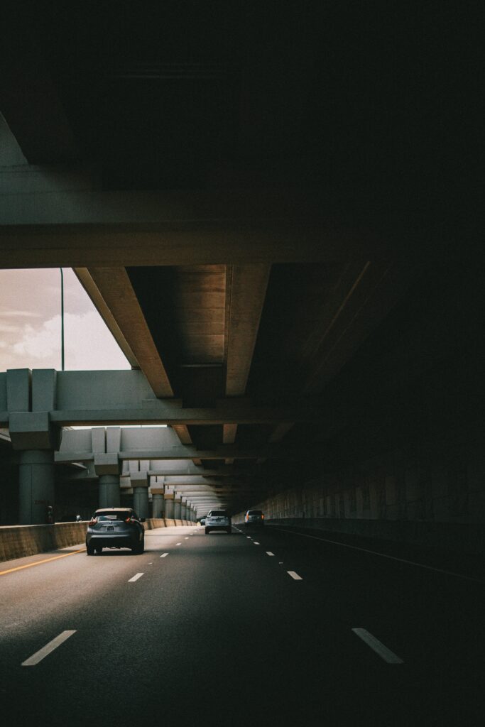 Urban Isolation: Dimly Lit Underground Road Wallpaper Background