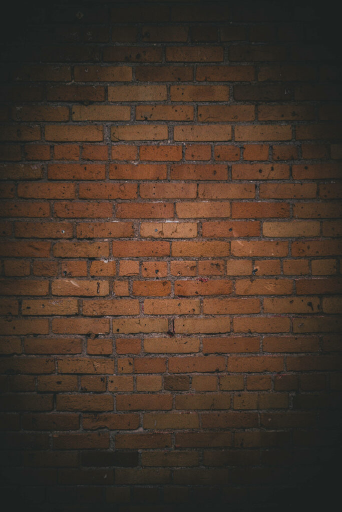 Moody Vintage Brown Brick Wall Wallpaper Background