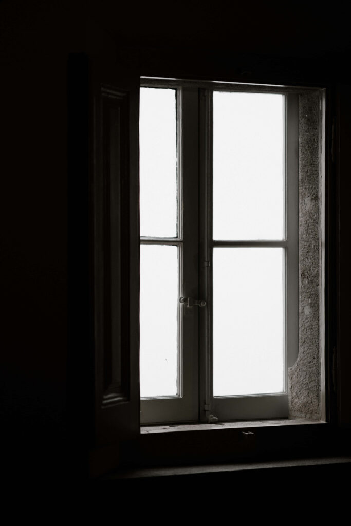 Mysterious Window Wallpaper: Moody Light & Atmospheric Background