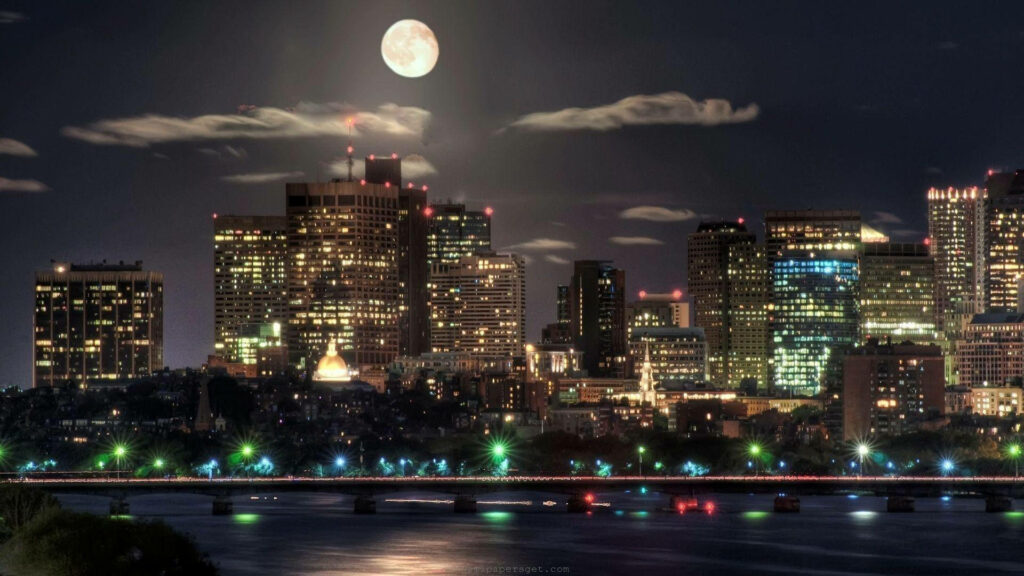 Moonlit Cityscape Wallpaper: Illuminated Skyscrapers & Reflections
