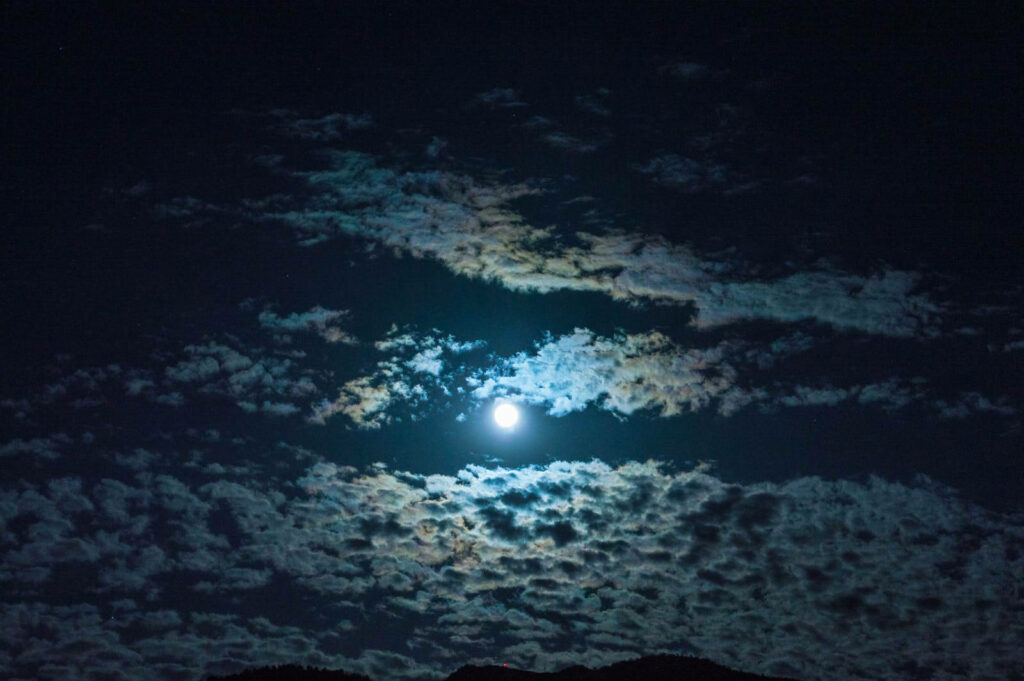 Silent Serenity: Captivating Moonlit Clouds Grace the Night Sky Wallpaper