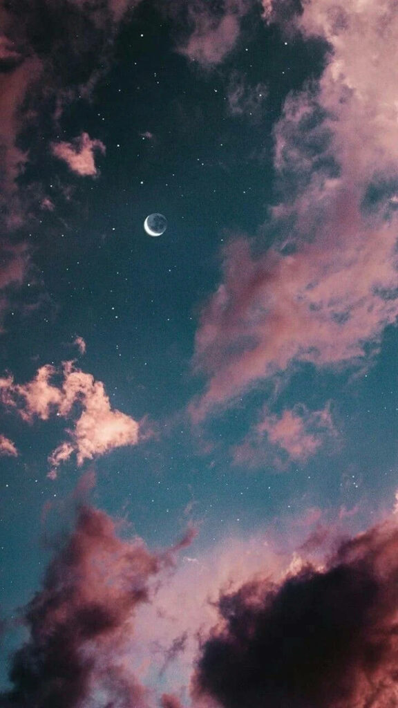Nighttime Tranquility: Captivating Crescent Moon amidst Cloud-Covered Sky - Aesthetic Phone Background Wallpaper