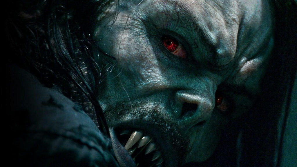 Morbius close up with red eyes sharp fangs and intense expression dramatic lighting wallpaper