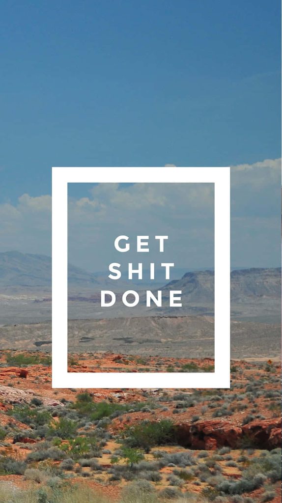 Motivational desert wallpaper with red rocks and bold Get Shit Done text for productivity boost