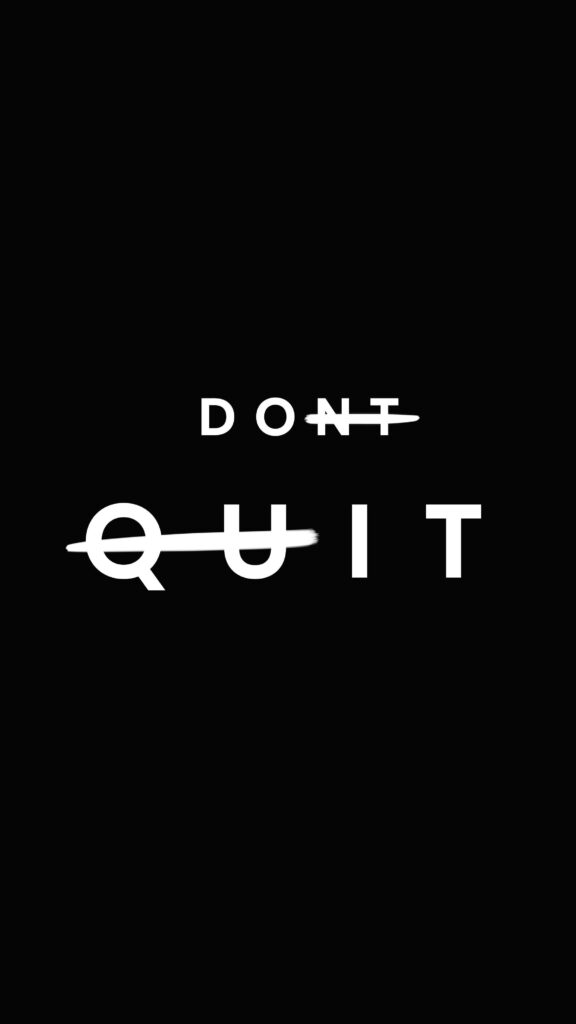 Motivational Black Wallpaper: 'Quit' Struck Out for Resilience