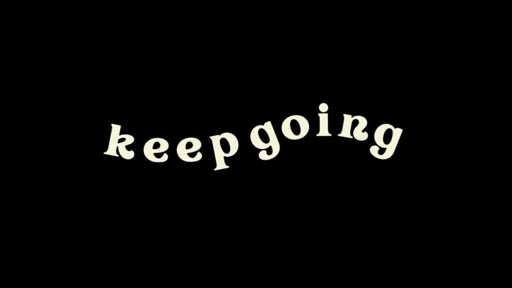 Minimalist 'Keep Going' Wallpaper: Cute Reminder on Dark Background
