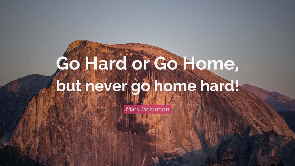 Motivational Quote Over Majestic Mountain Landscape at Sunset Wallpaper
