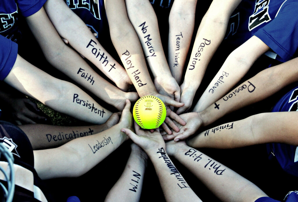 Motivational Softball Wallpaper: Teamwork & Passion in Unity