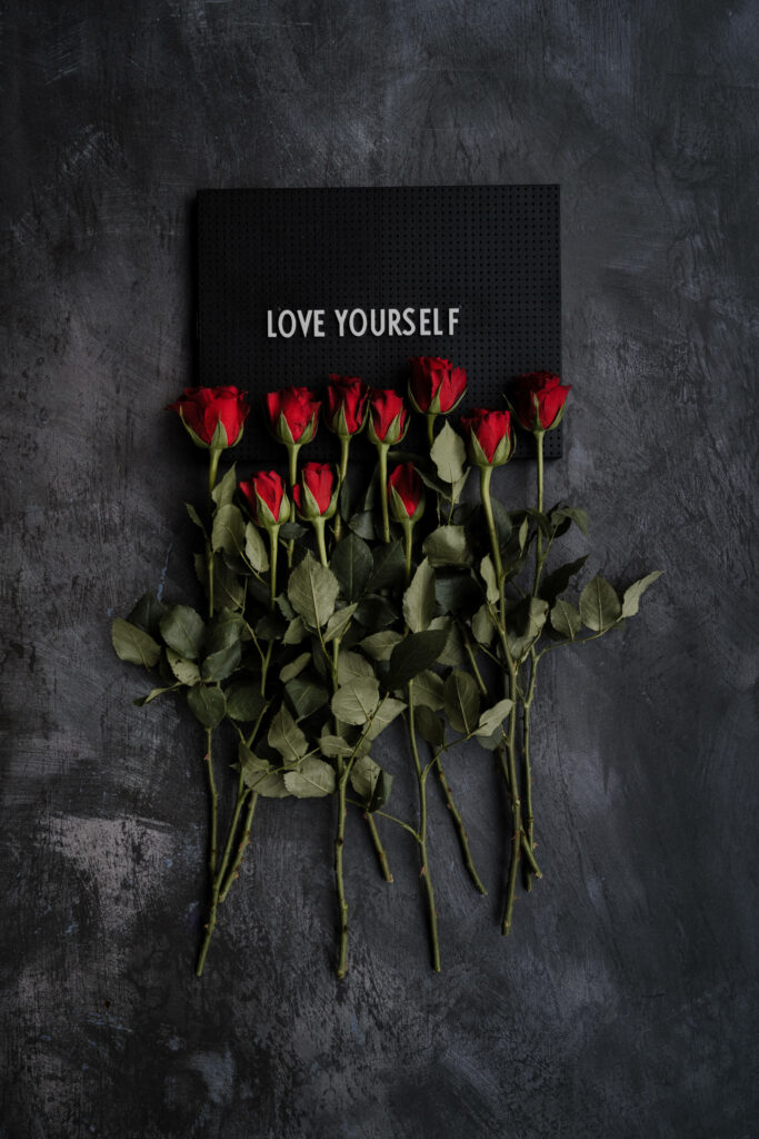 Vibrant Red Roses on Dark Background: Love Yourself Wallpaper