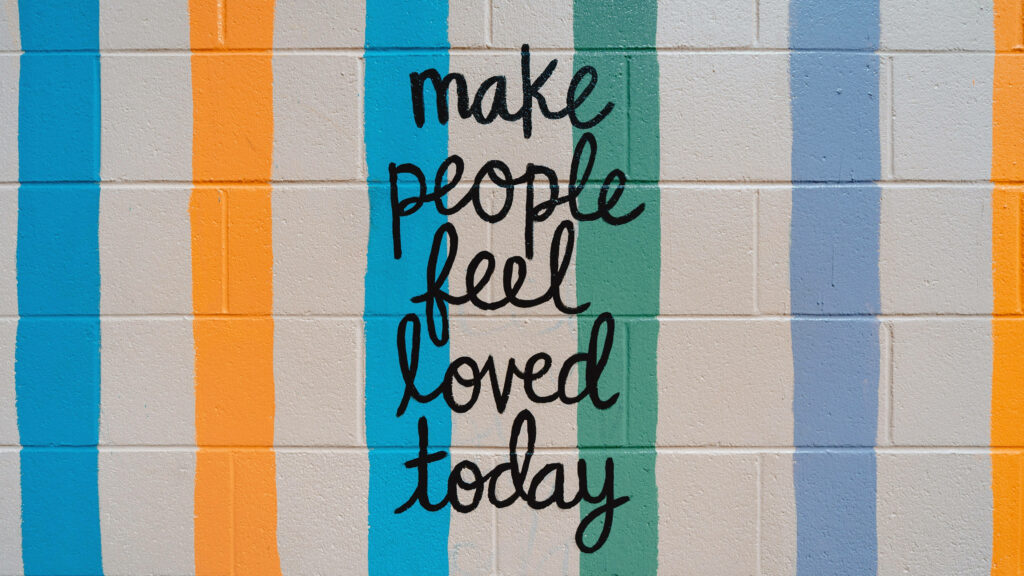 Motivational Brick Wall Wallpaper: Love & Positivity Design