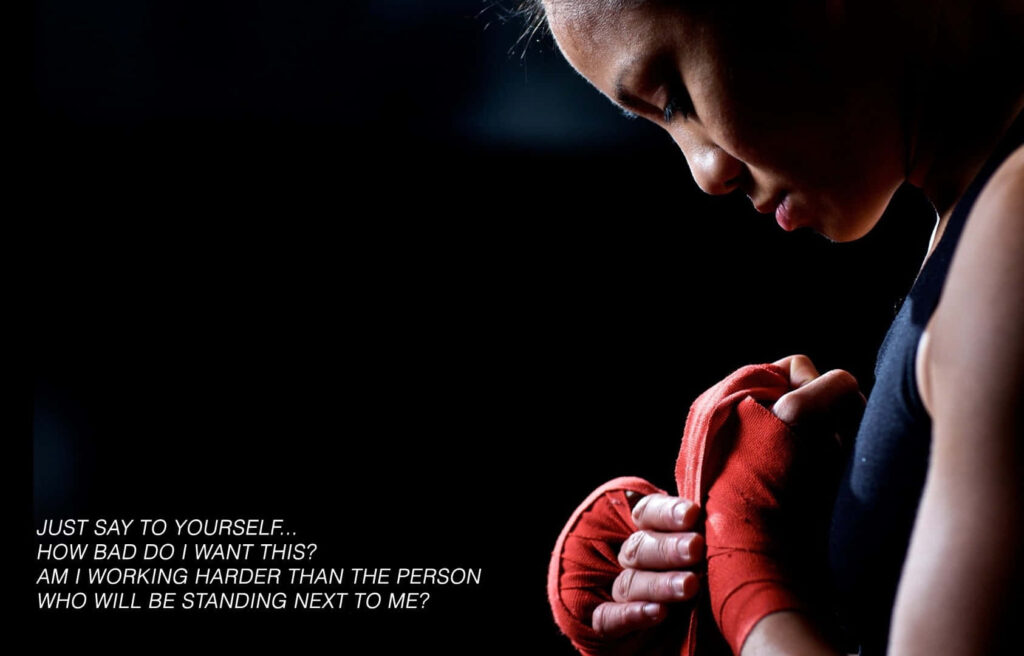 Focused Individual Prepares for Action: Motivation & Self-Reflection Wallpaper