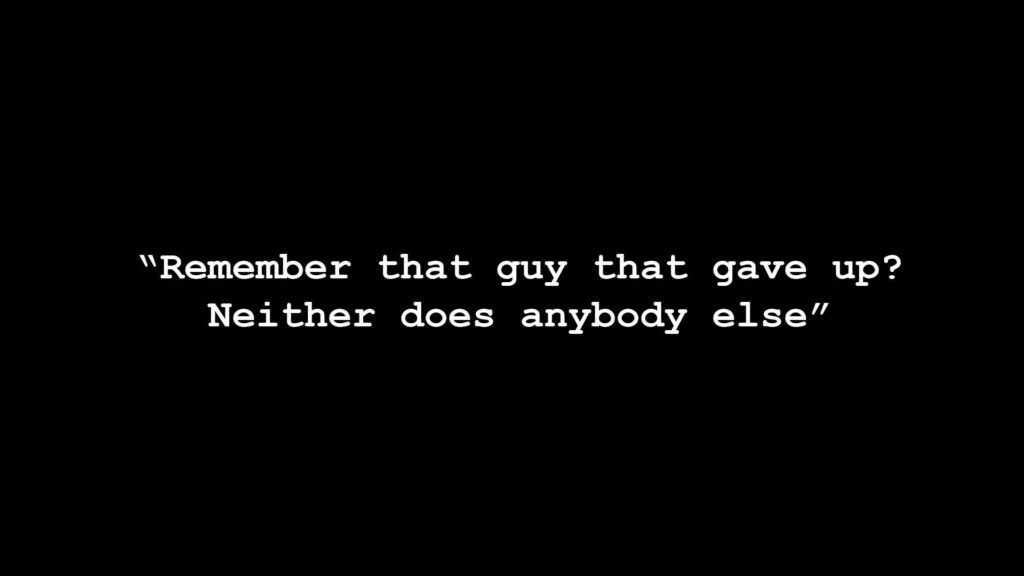 Motivational Black Wallpaper: 'Remember That Guy Who Gave Up?'
