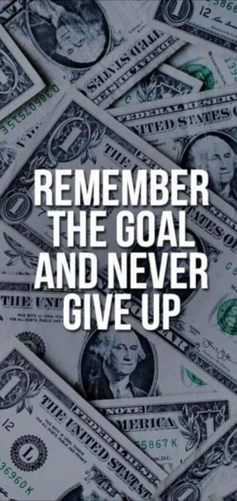 Motivational wallpaper with Remember the goal never give up text over scattered US dollar bills background